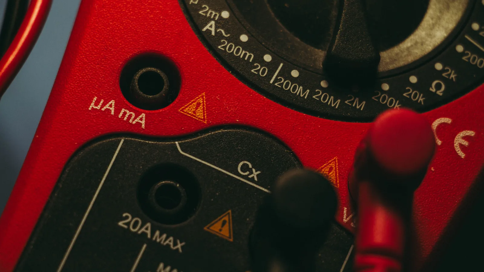 Detailed image of a red multimeter, showcasing measurement dial and connectors, ideal for tech enthusiasts. 9 points worth checking on technology listing problems