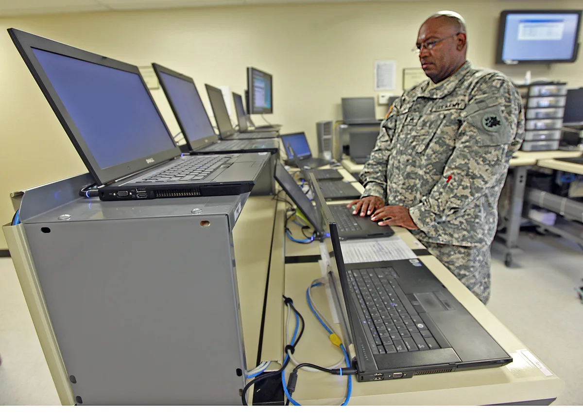 Sergeant Marion Kelly, one of the JFHQ IT section's two computer imaging technicians, does repair work on a government laptop. Once the work is completed, Kelly will rescan its barcode for return to the customer service desk for pickup. Upgrade, repair, or replace a laptop: a decision guide
