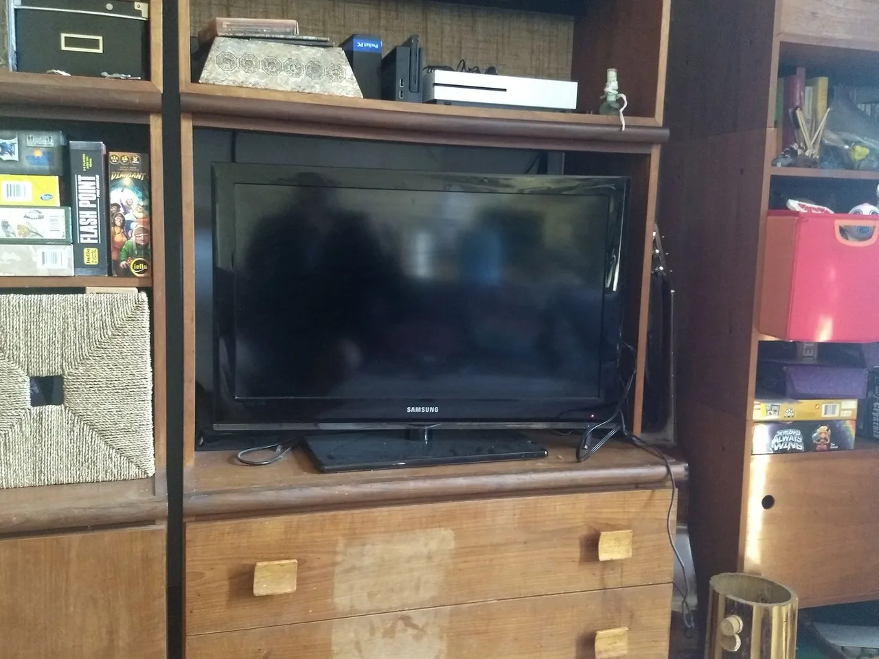 A flat-screen television placed in a living-room cabinet